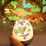 DinoGlow™ Projection Night Light-Rotating Star Projector with Music & Films