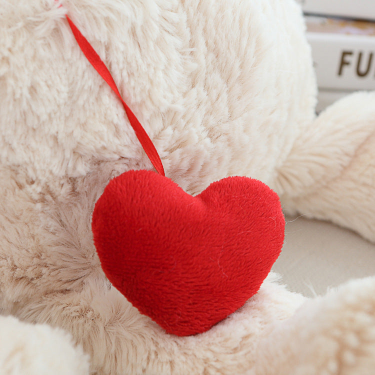 Love Heart Teddy Bear Plush, held in hand for scale